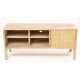 Solid wood tv unit in a unapinted finish with six shelf compartments and two sliding doors with woven rattan fronts