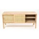 Solid wood tv unit in a unapinted finish with six shelf compartments and two sliding doors with woven rattan fronts