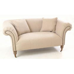 Small Sofa in a Boucle faric with flaired arms and back rest including two cushions