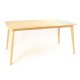 Solid wood rectangular dining table with softly rounded table legs and a plain wood finish