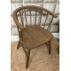 Solid wood vintage curved carver style chair with continuous arm back and finished with dark finish