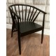 Solid sungkai wood round tub chair with well spaced spindles and black painted finish