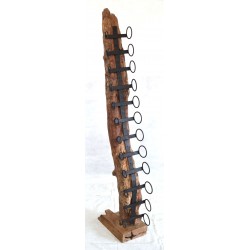 A twelve bottle wine rack with metal bottle holders attached to a tree root board in individual shapes