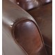 Vintage leather two seat sofa with button back and front detail solid wood feet and frame