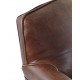 Vintage leather armchair with stud detail on a solid wood frame