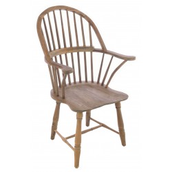 Solid wood carver chair in a windsor continuous arm style with a vintage stripped back finish