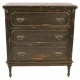Solid wood 3 drawer chest of drawers with intricate carving on the drawer front and legs finished with distressed black paint