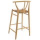 Solid wood bar chair with rush seat and a plain wood finish designed in an curved wishbone style