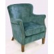 Deep Green Velvet small armchair with a solid wood frame under the soft velvet upholstery