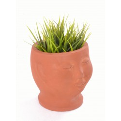 Hand made terracotta plant pot in the style of a small bust with a unglazed finish
