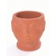 Hand made terracotta plant pot in the style of a small bust with a unglazed finish