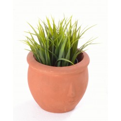 Hand made terracotta plant pot with a shallow stylised face