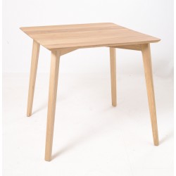 Square dining table or bistro table in a retro mid century style with a rounded cornered flat top and oval profile legs