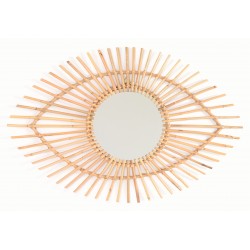 Round mirror with a woven natural finish rattan frame in the shape of an stylised eye